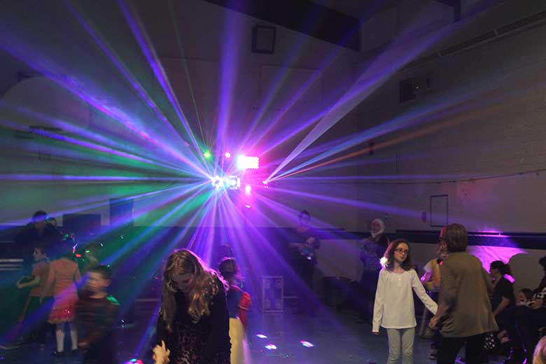 School Light Show, Hamilton DJ, Family Dance Multi color Beams of light fanning out everywhere coming from the light show. Taken in Hamilton Ontario.